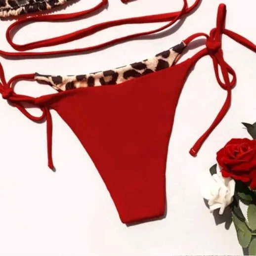 Women's leopard print bikini swimsuit with halter neck and lace-up front design