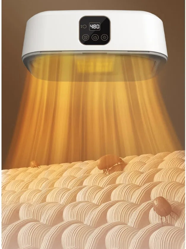 White foldable cylindrical laundry dryer with remote control on a table.