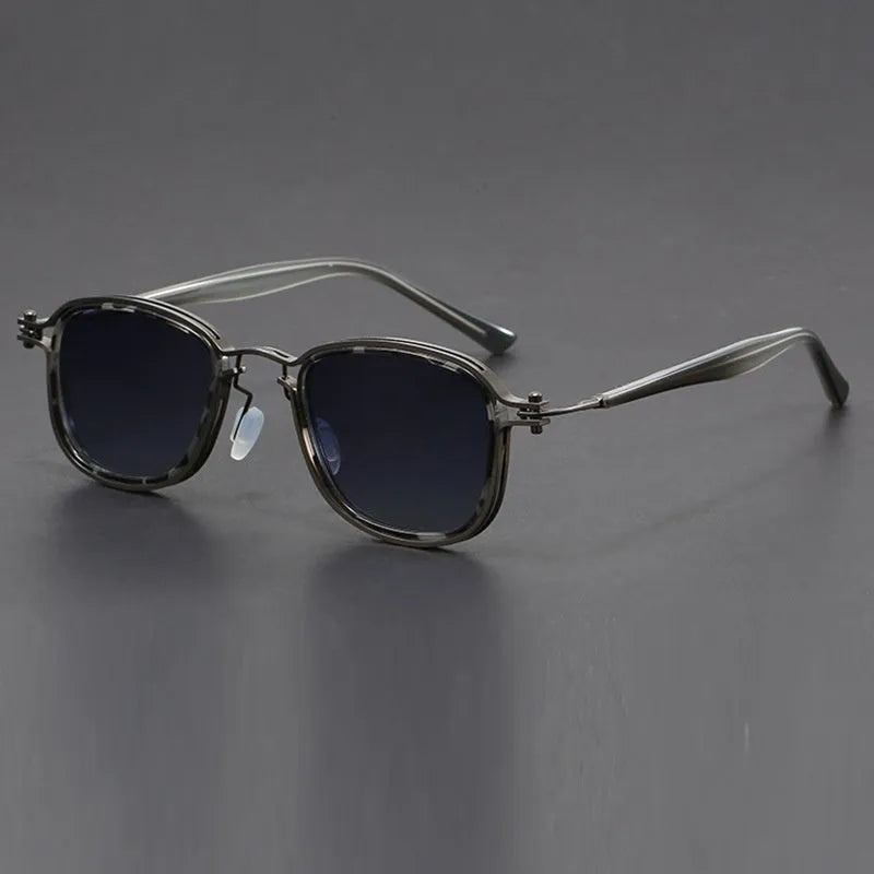 Retro square sunglasses with metal decorative patterns and tinted lenses in a two-tone colour finish.