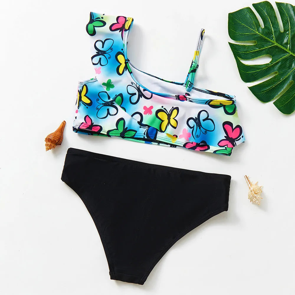 Girls' two-piece swimsuit with oblique shoulder strap, split design, polyester fabric, in butterfly, graffiti, or lemon yellow.