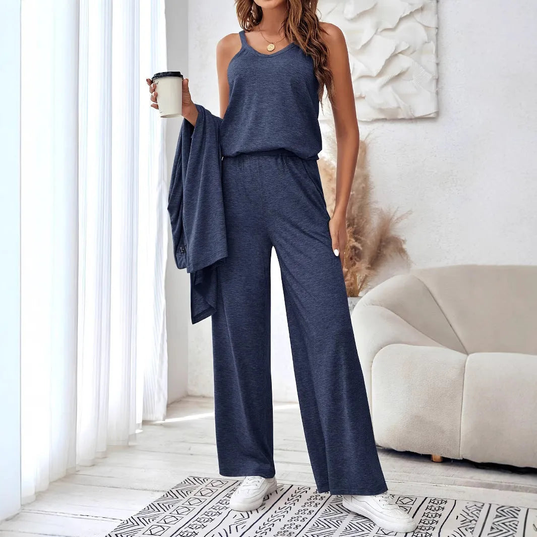 Blue women's casual two-piece suit with top, trousers, and black suspenders laid flat.
