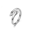 Geometric titanium steel ring with stamping finish in silver colour on a neutral background