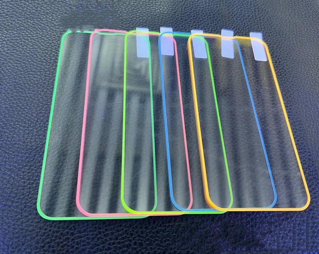 Glow-in-the-dark pink tempered glass screen protector fitted on an iPhone 13 Pro Max showing full-screen coverage.