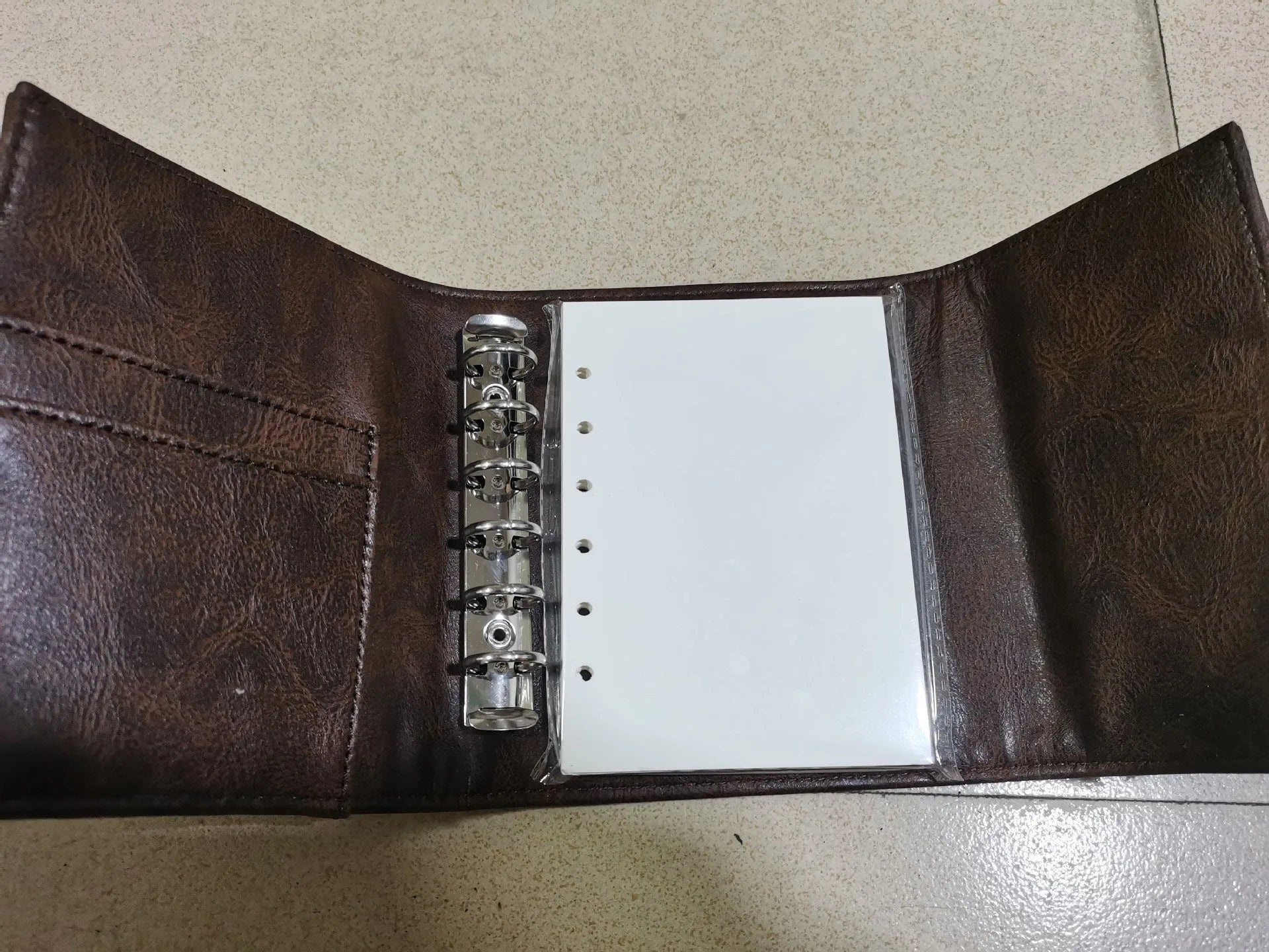 Creative retro brown A7 notebook with leather-style buckle and loose-leaf binding