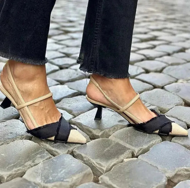 Women's apricot and black colour block stiletto sandals with pointed toe and buckle strap.