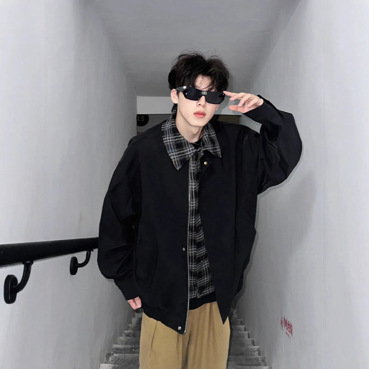 Men's fake two-piece jacket in black or brown, loose fit, long sleeves, side seam pockets, polyester