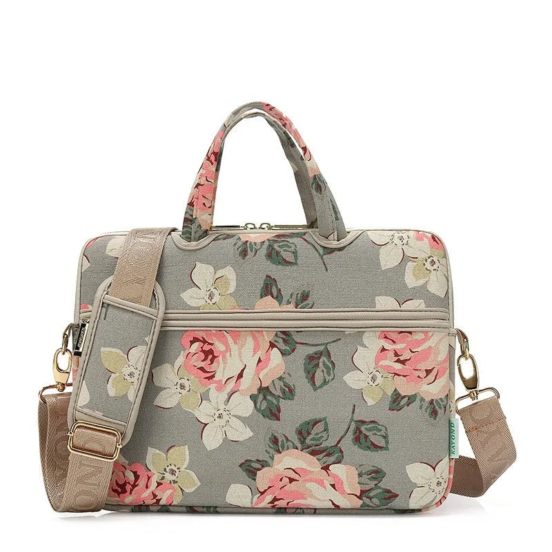 Canvas laptop sleeve with printed pattern for 13-15 inch notebooks, plush lining, and padded shoulder strap