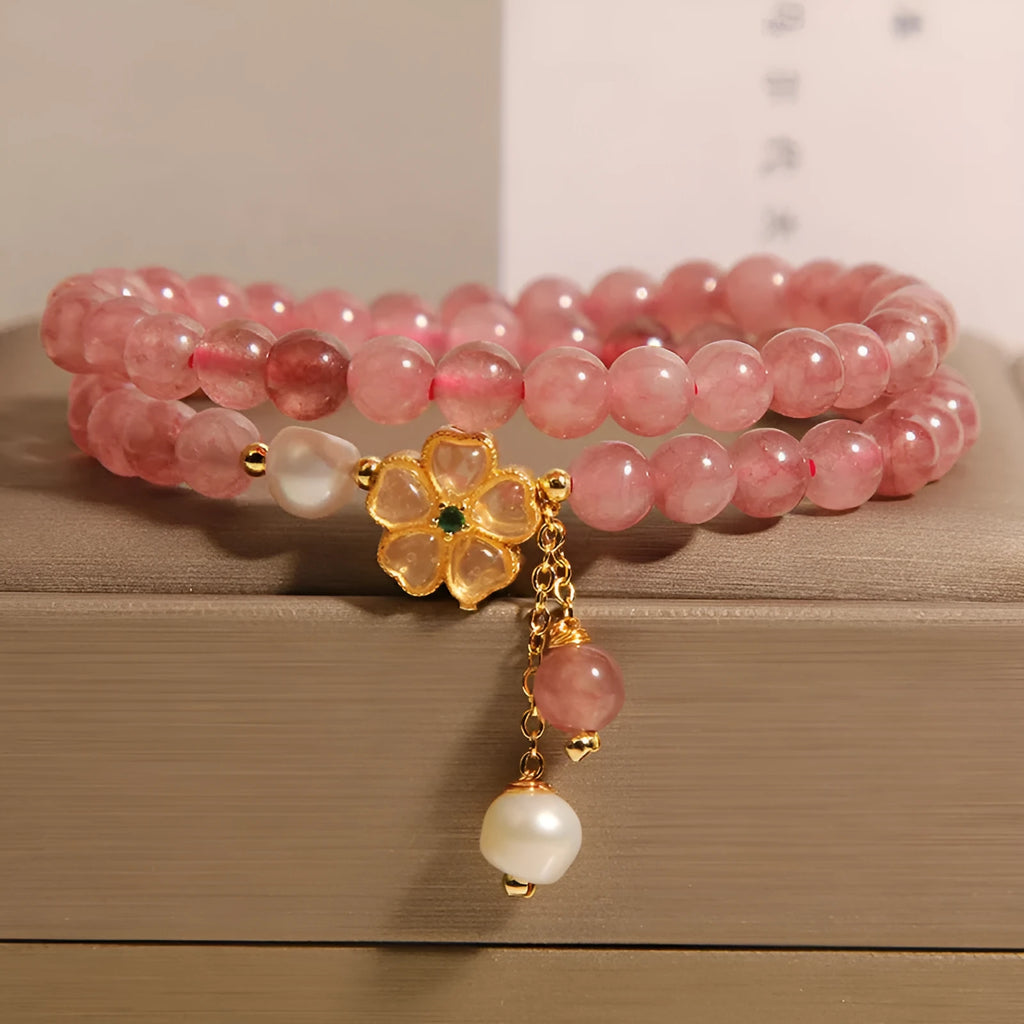 Women's twin four-leaf clover charm bracelet with strawberry quartz crystals and alloy inlay settings.