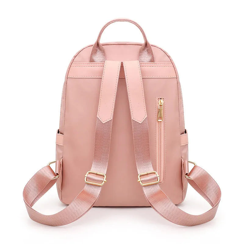 Black casual nylon backpack with double shoulder straps and external pocket.