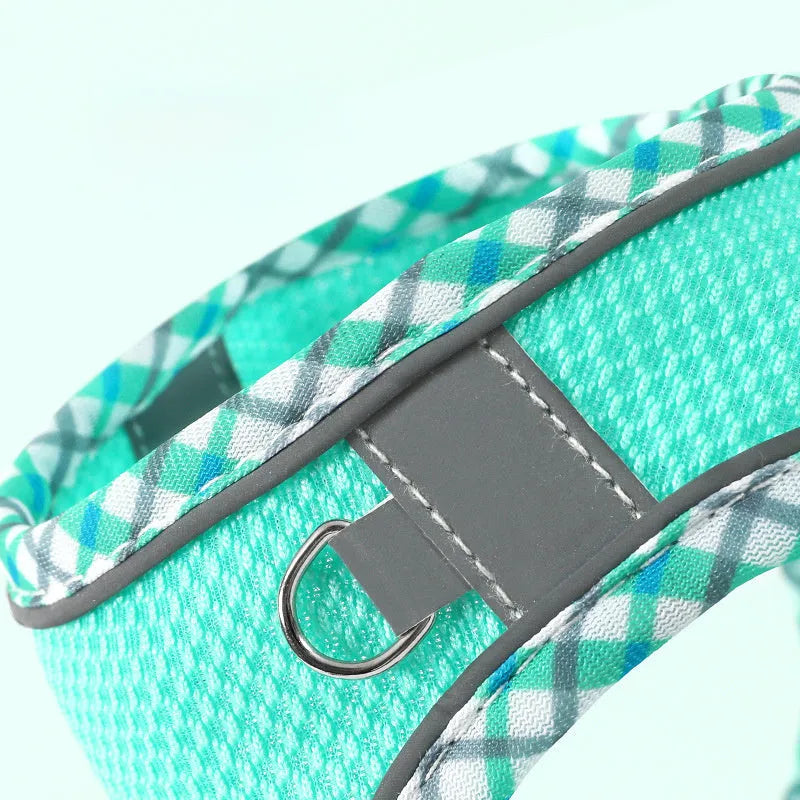 Step-in dog harness with leash showing breathable mesh and reflective vest design