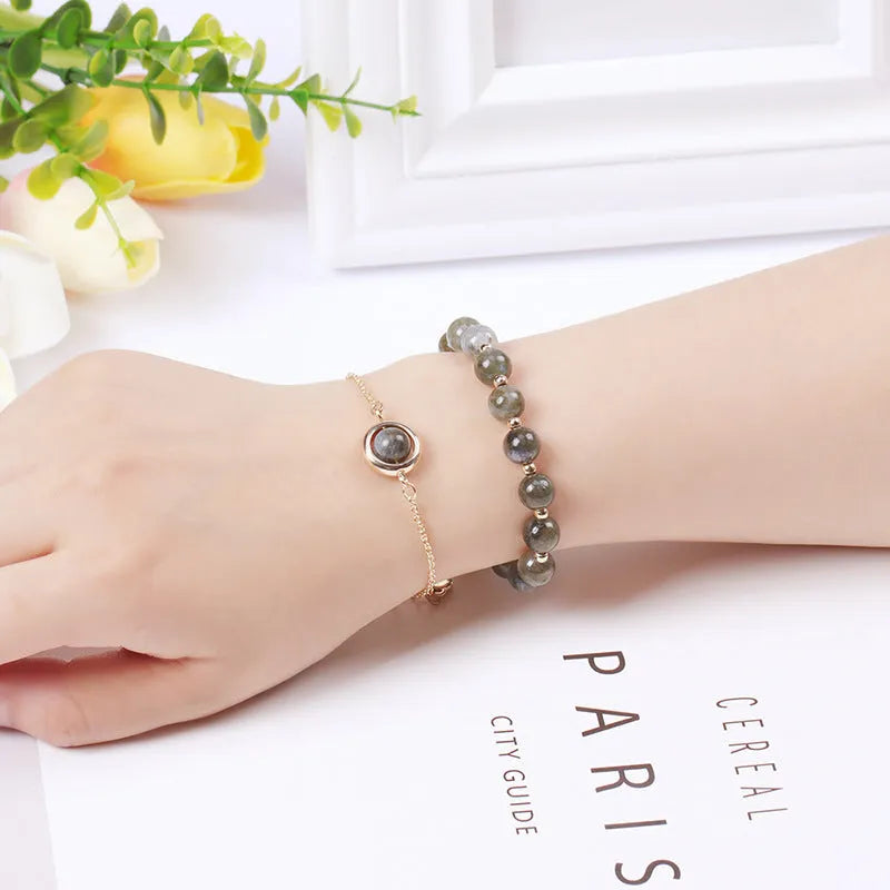 Double-layer women's bracelet with crystal beads and lucky charms in gold electroplated finish