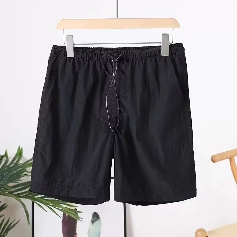 Men's quick-drying straight-leg sports shorts in polyester blend fabric, shown in multiple colour options