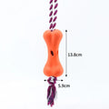 Green porous bone dog toy with knotted rope ends and food cavity for cheese or beef strips