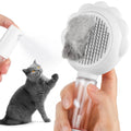 Grey spray cat brush with release button and stainless steel bristles for pet grooming