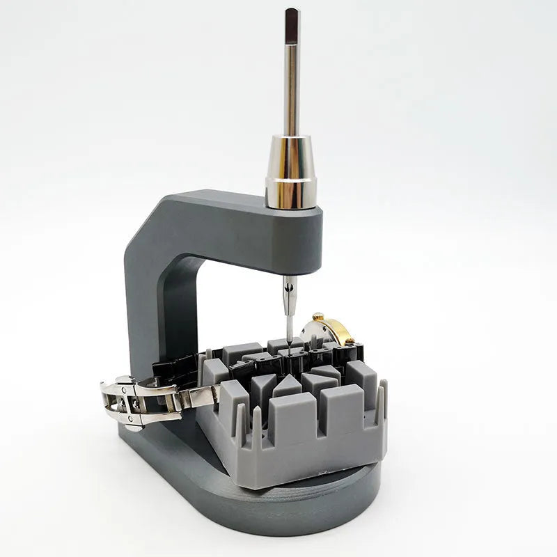 Silver-coloured tool steel press strap removal tool for watches and jewellery.