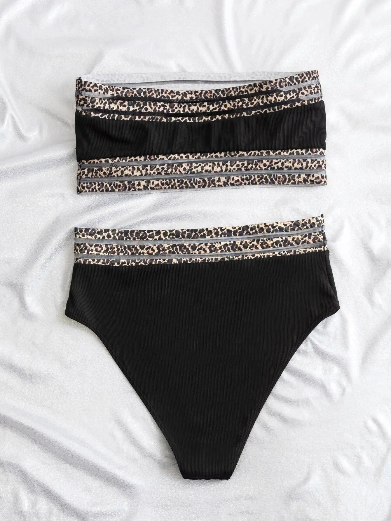Black strapless swimsuit with leopard print detail on the briefs.