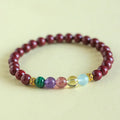 Purple gold cinnabar crystal bead bracelet with adjustable knot on wrist
