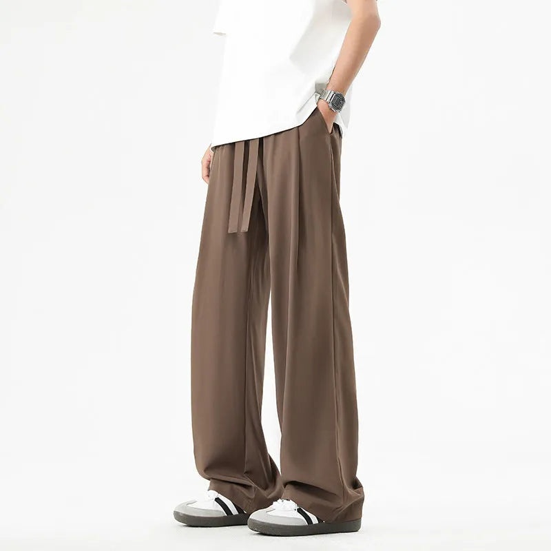 Men's quick-drying loose straight wide-leg casual pants in black polyester blend, side view