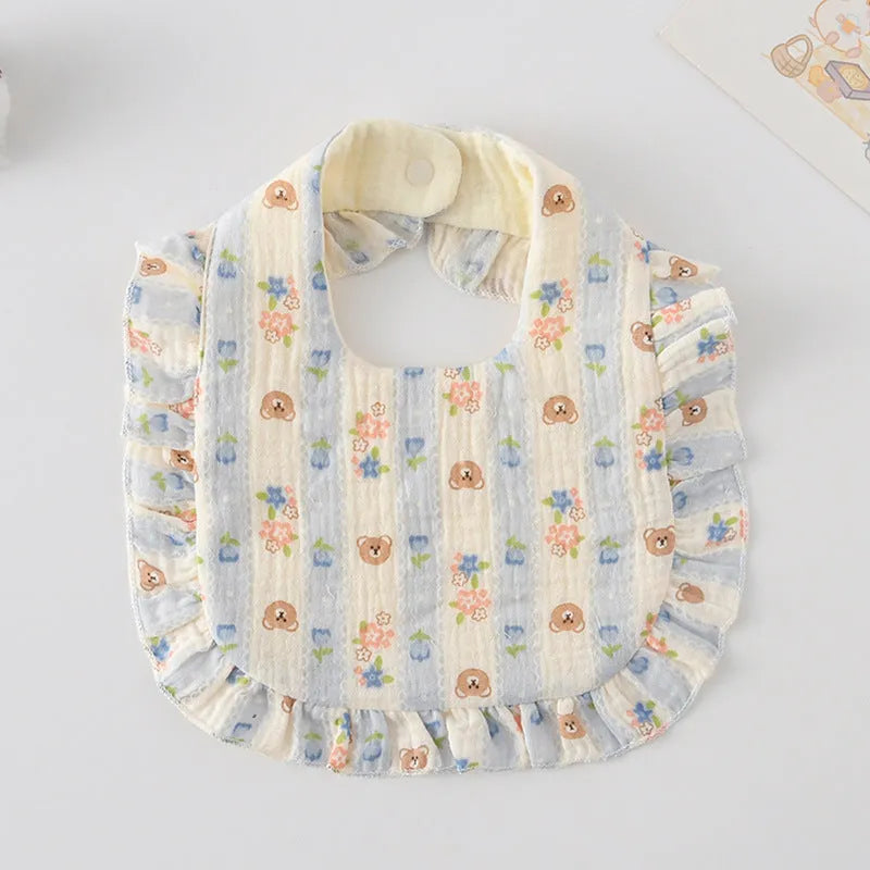 Six multi-coloured cotton muslin baby bibs with animal bandana designs and adjustable snaps