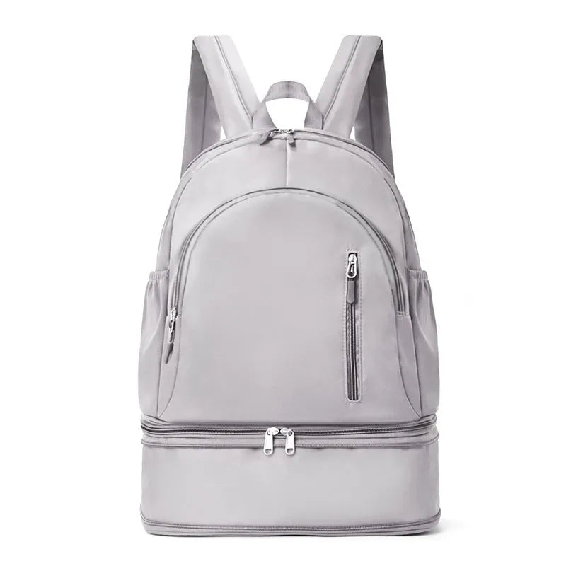 Women's casual backpack in black with curved adjustable shoulder straps showing stitching details