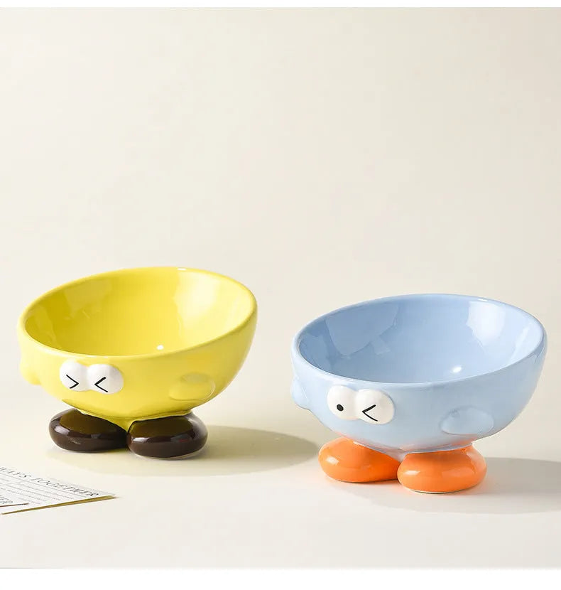 Blue slanted ceramic pet bowl with cute expression design for cat and dog cervical spine support