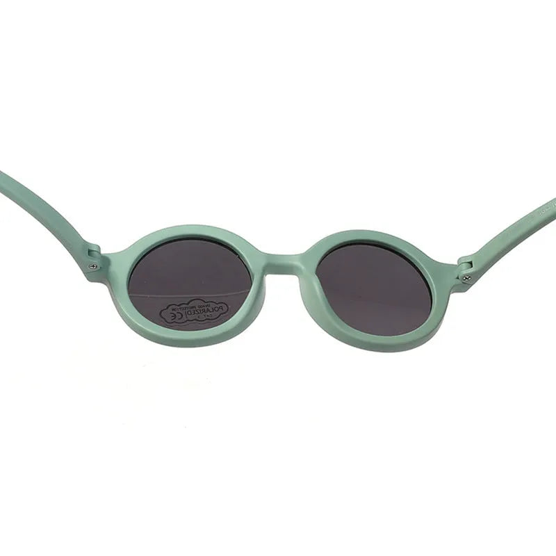 Children's silicone sunglasses for 0-3 year olds with round frame and polarized lenses in multiple colour options