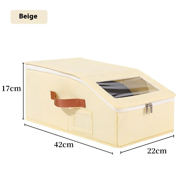Grey foldable woven fabric storage box with lid, shown next to baseball caps.