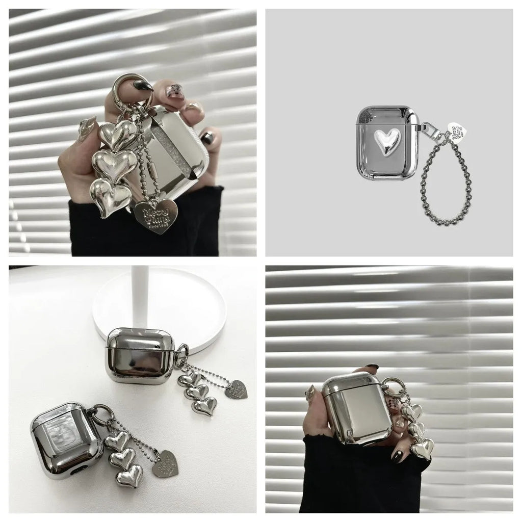 Electroplated solid colour iPhone headphone case with heart pendant attachment on a soft TPU shell.
