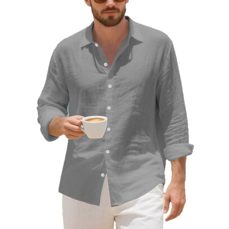 Man wearing a loose-fit light blue linen casual shirt with non-iron finish, showing relaxed American style.