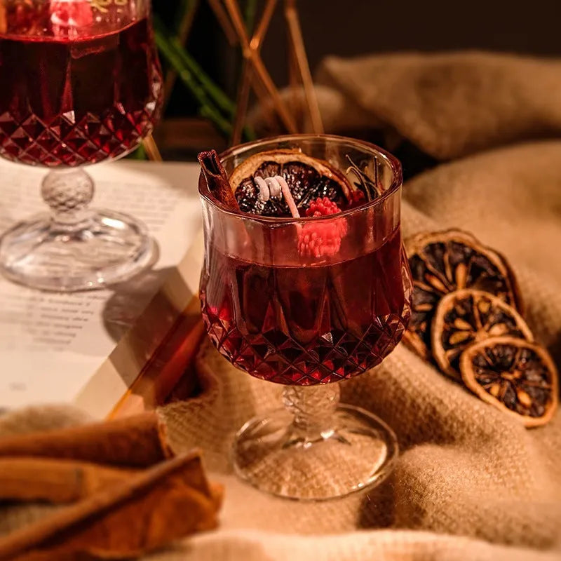 Scented candle in a glass wine goblet with translucent jelly crystal wax and French mulled wine label.