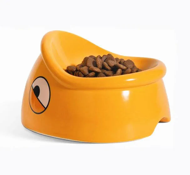Orange ceramic pet food bowl with fish head pattern, 196x121x149mm, on floor