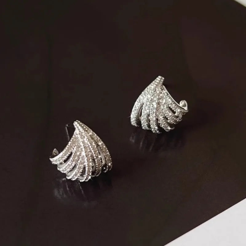 A pair of women's geometric drop earrings in a platinum colour, made from zircon with an electroplated finish.