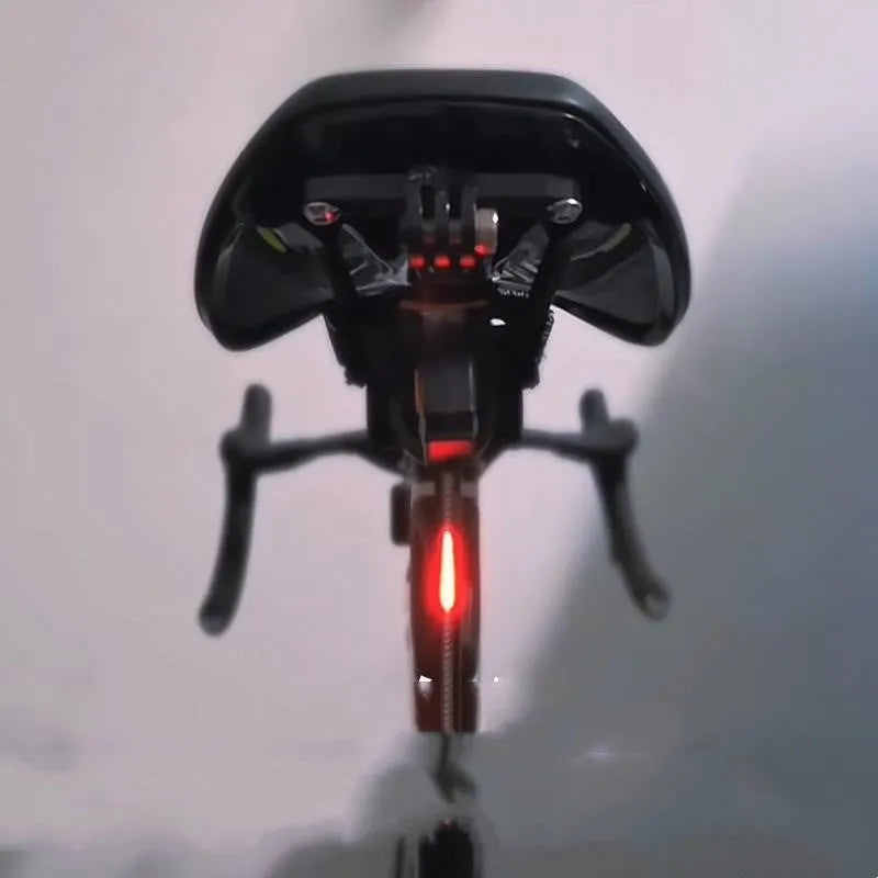 USB-charging waterproof bicycle taillight for night riding shown in blue, pink, red, white and yellow colour options.
