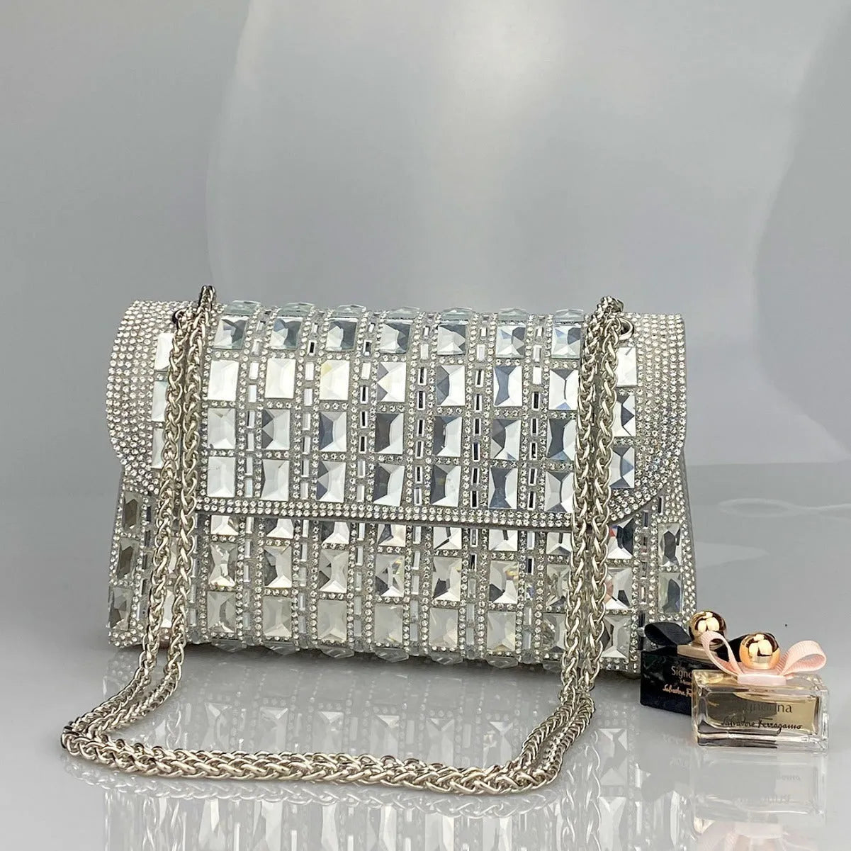 Glass rhinestone chain clutch handbag in horizontal square shape with retro styling and chain strap