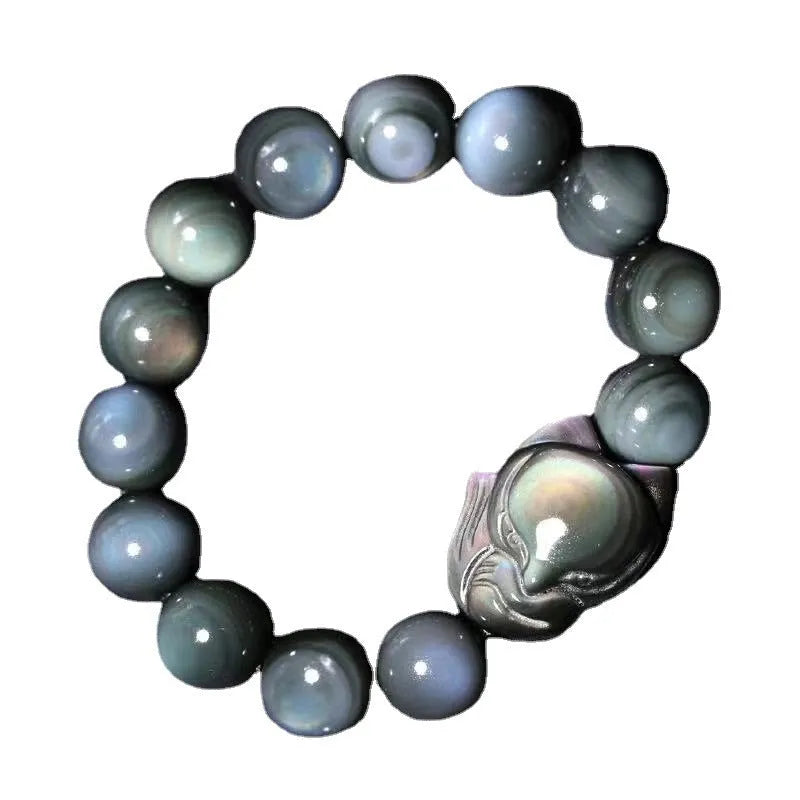 Black obsidian fox carved bracelet showing detailed animal design on polished gemstone