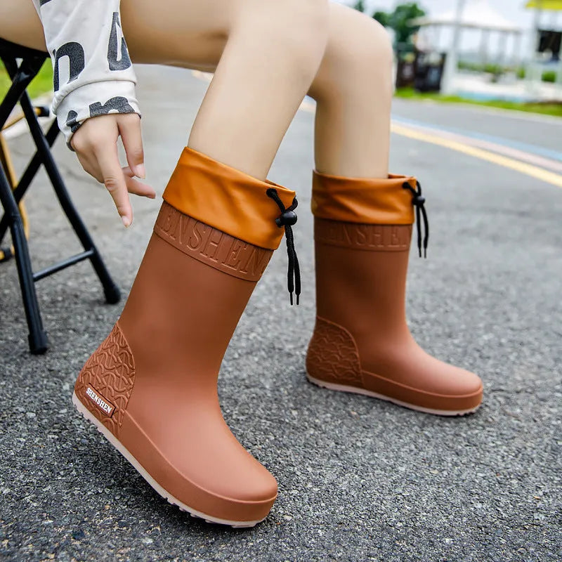 Women's solid colour rain boots with non-slip soles and waterproof mouth design in apricot, black, brown, or pink