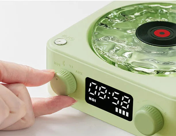Retro turntable Bluetooth speaker with rotating transparent disc and RGB lighting effects