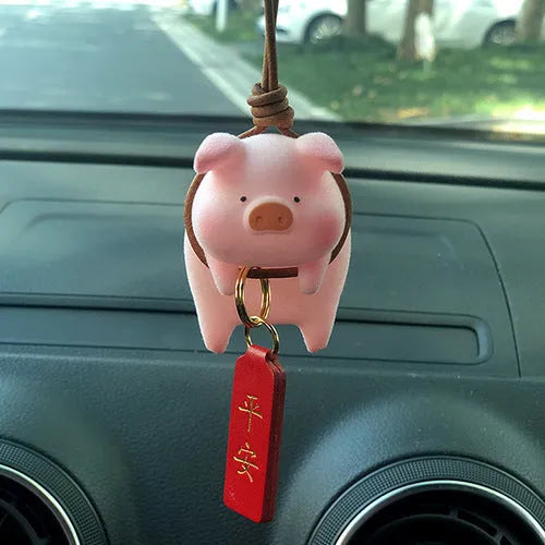 Glossy resin cartoon pig ornament for car dashboard decoration, shown in one of eight available character styles.