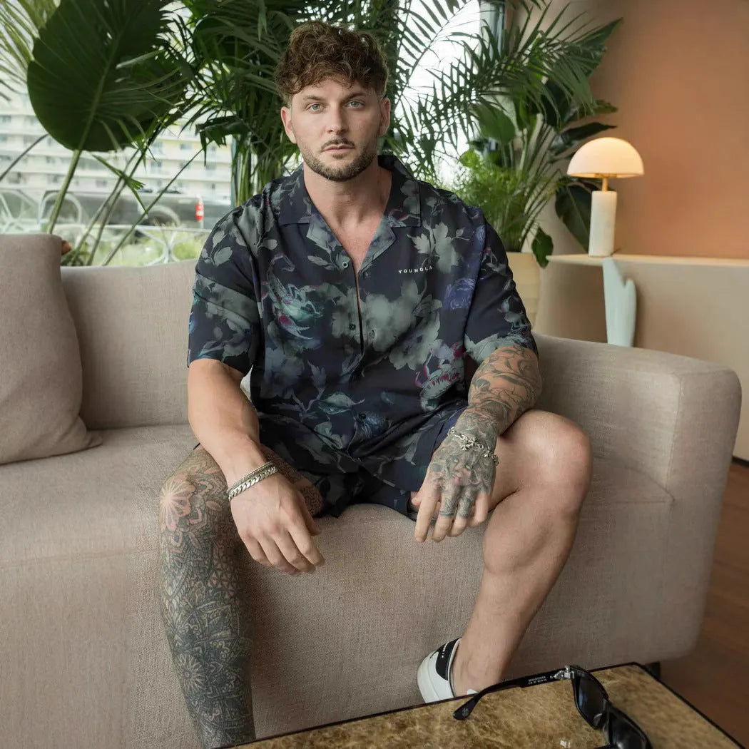 Men's loose-fit short-sleeve top with floral print in a light colour, shown on a hanger.