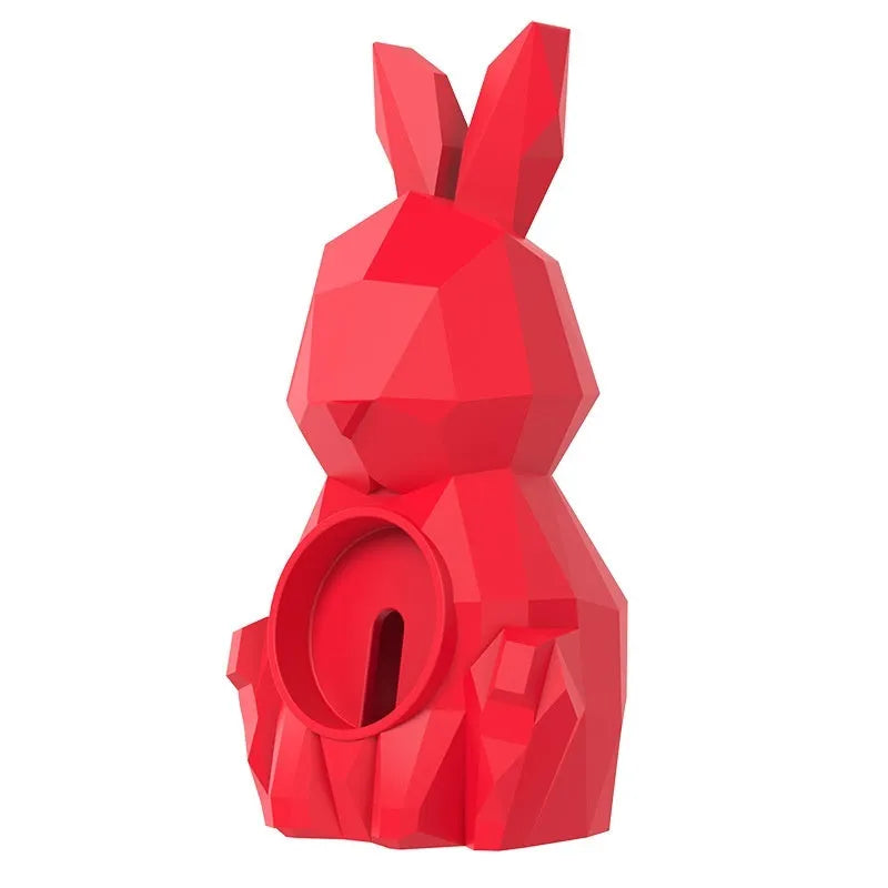 Rabbit-shaped silicone desk charger bracket in white with wrist strap holding a charging cable