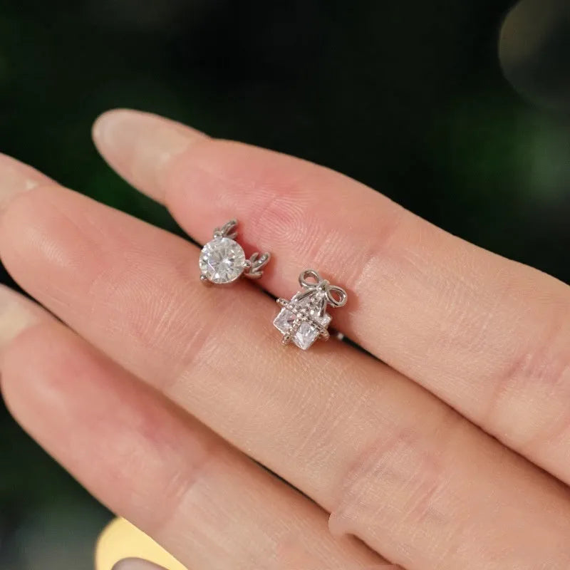 Pair of 925 sterling silver irregular bow and deer earrings with zircon inlay