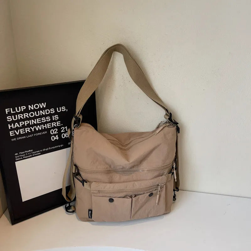 Women's soft nylon crossbody bag in square vertical shape with dual shoulder straps
