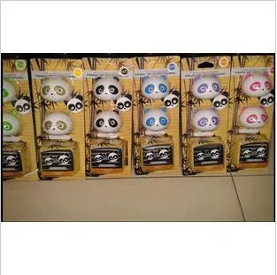Pair of panda grain car vent perfume decorations in black and brown showing clip attachment