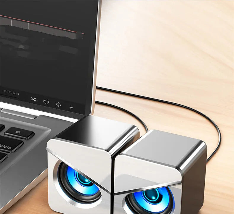 Black and white USB mini desktop stereo speaker showing simple, standard, and upgraded versions