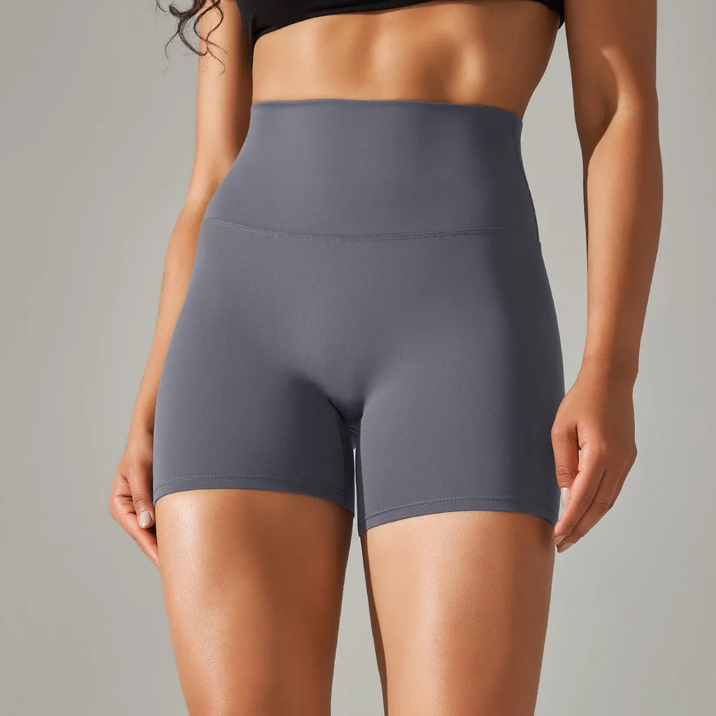Women's high waist fitness tights in dark green, showing belly control and hip lift design for sports.