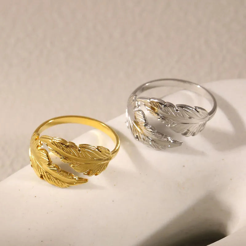 Adjustable stainless steel feather ring showing electroplated finish in silver or gold colour option