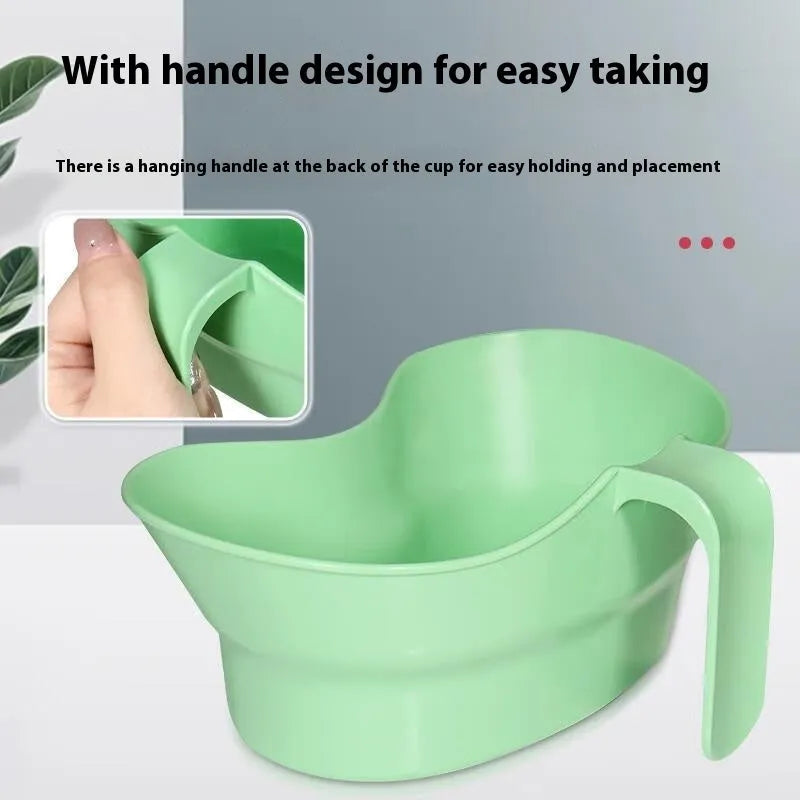 Green plastic gargle cup for bedridden elderly oral care.