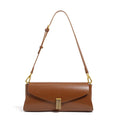 Women's leather cross-body shoulder bag in clamshell design with internal organisers.