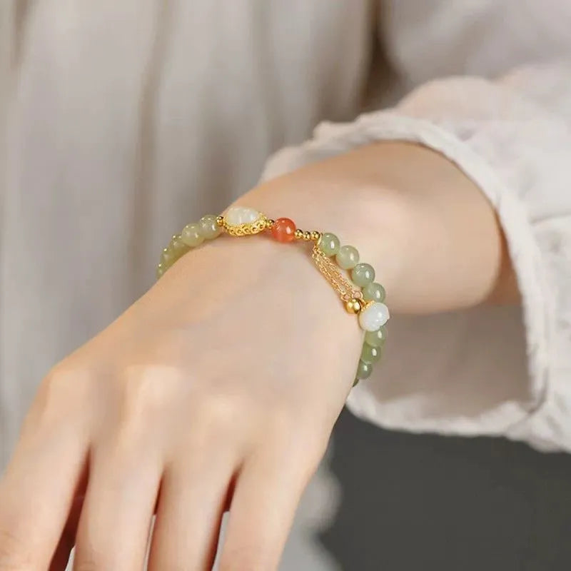Qingshui jade women's bracelet with gold gourd design and fu character symbol
