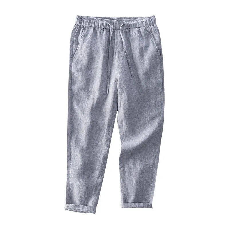 Men's straight leg linen trousers in light grey colour showing mid waist and relaxed fit